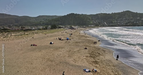 Pacifica California Aerial v3 low level flyover state beach at linda mar capturing beachgoers on the sandy shore with san pedro mountain valley view on a sunny day - Shot with Mavic 3 Cine - May 2022