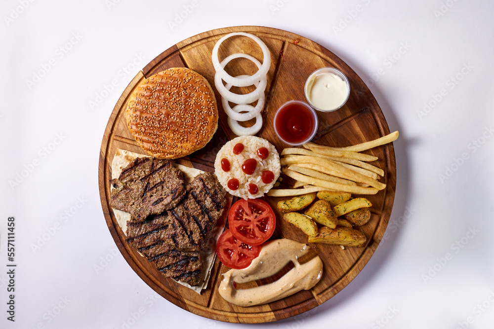disassembled hamburger, on a wooden tray, on a white background disassembled hamburger, on a wooden tray, on a white background