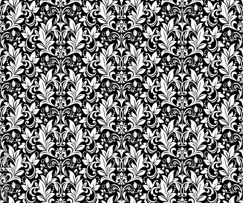 Wallpaper in the style of Baroque. Seamless vector background. White and black floral ornament. Graphic pattern for fabric, wallpaper, packaging. Ornate Damask flower ornament