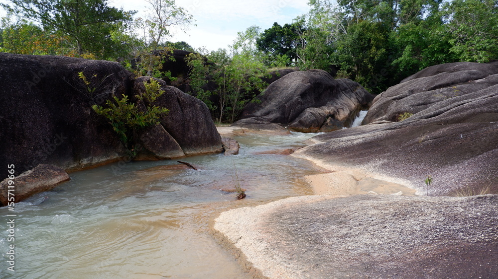 Fototapeta premium Mountain rock formations with flowing river water