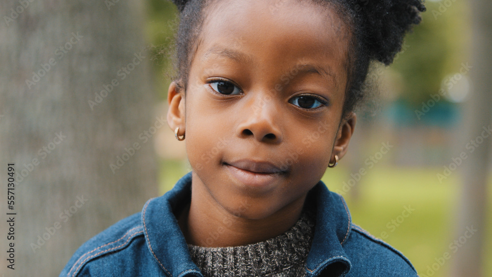 Little African American girl outdoors close up child pretty