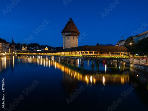 Image of Lucerne, Switzerland, with the famous historical wooden Chapel bridge, during twilight blue hour. © Taljat