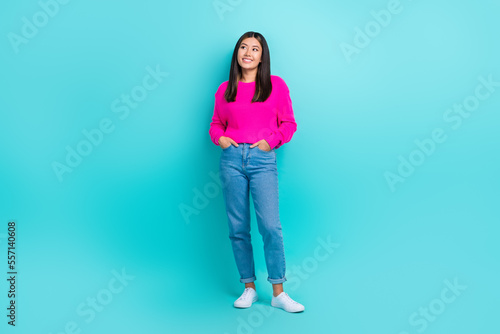 Full length photo of cool thoughtful girl dressed pink pullover looking empty space isolated teal color background