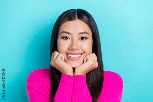 Close up photo of cheeful nice lady wear fashionable clothes two arm under chin isolated on cyan color background photo