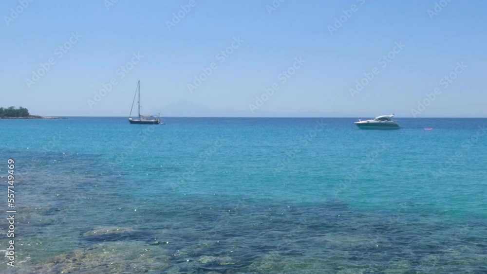 Breathtaking view of clear turquoise color of sea, seascape with boats at bay. Clear blue sky on a sunny day. Summer travel holidays concept. Panoramic view. Breathtaking view of clear turquoise color of sea, seascape with boats at bay. Clear blue sky on a sunny day. Summer travel holidays concept. Panoramic view.