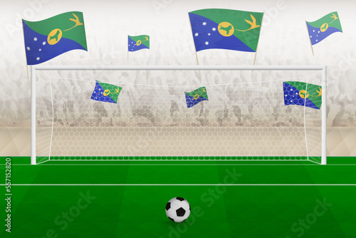 Christmas Island football team fans with flags of Christmas Island cheering on stadium, penalty kick concept in a soccer match.