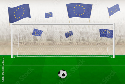 European Union football team fans with flags of European Union cheering on stadium, penalty kick concept in a soccer match.