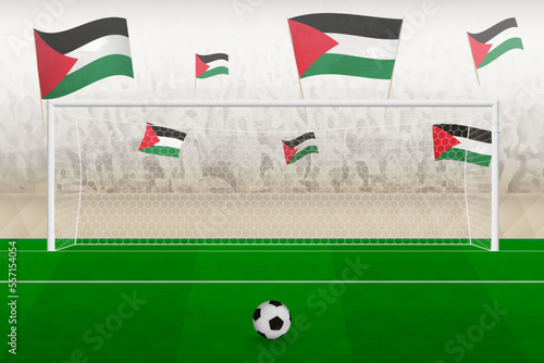 Palestine football team fans with flags of Palestine cheering on stadium, penalty kick concept in a soccer match.