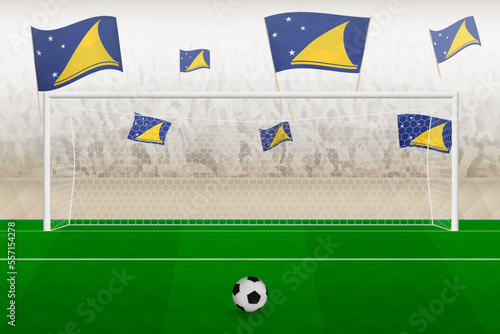 Tokelau football team fans with flags of Tokelau cheering on stadium, penalty kick concept in a soccer match.