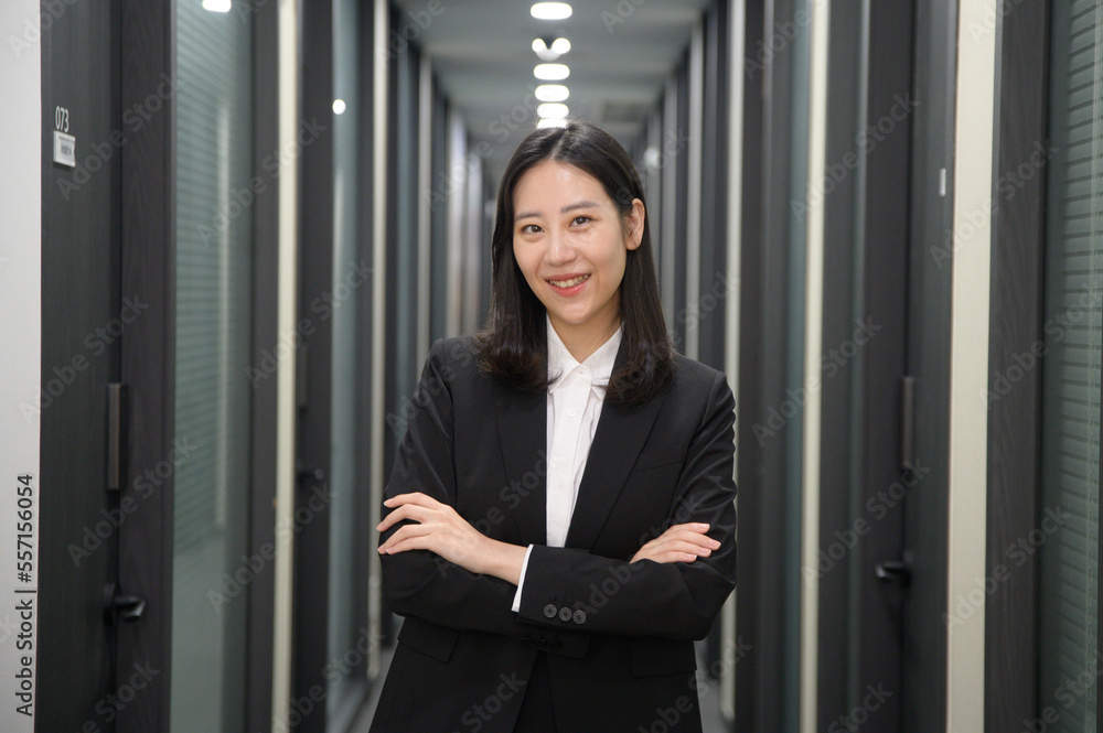 Fototapeta premium Portrait of successful asian young businesswoman working in her office