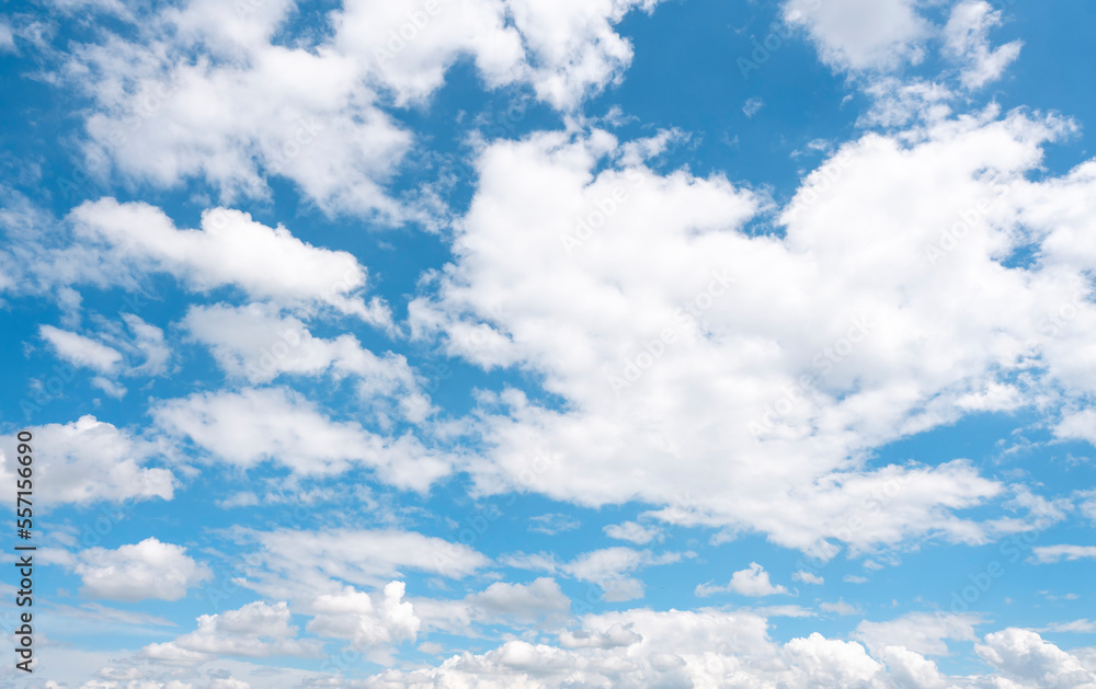 white cirrus, feathery clouds against spring bright blue cloudy sky on sunny day in England white cirrus, feathery clouds against spring bright blue cloudy sky on sunny day in England