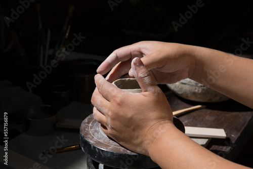 Hand close up of Young Asian female in the pottery workshop 
