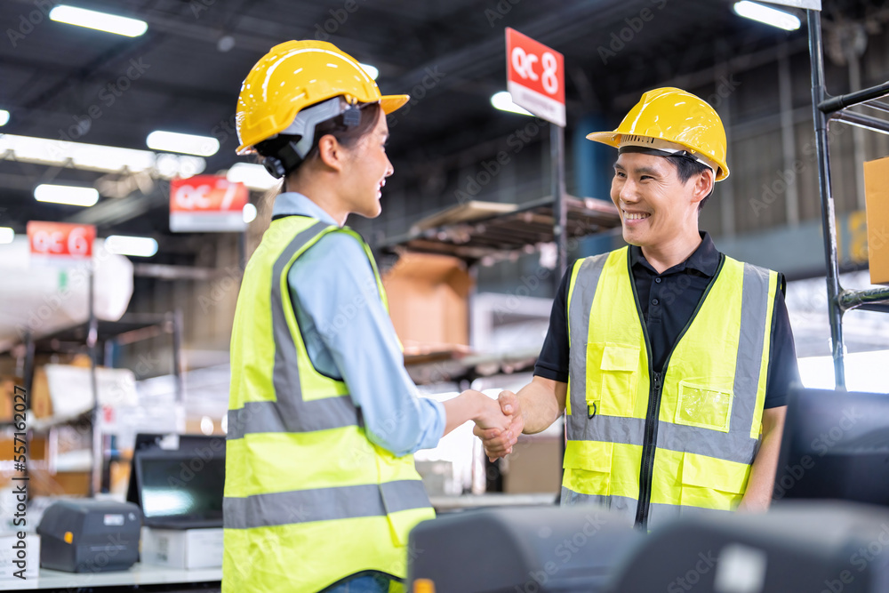 Staff working in large depot storage warehouse trainee check packing box and scan at cashier counter Staff working in large depot storage warehouse trainee check packing box and scan at cashier counter