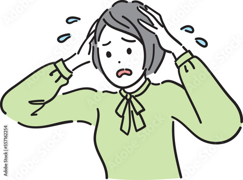 頭を抱えている女性
