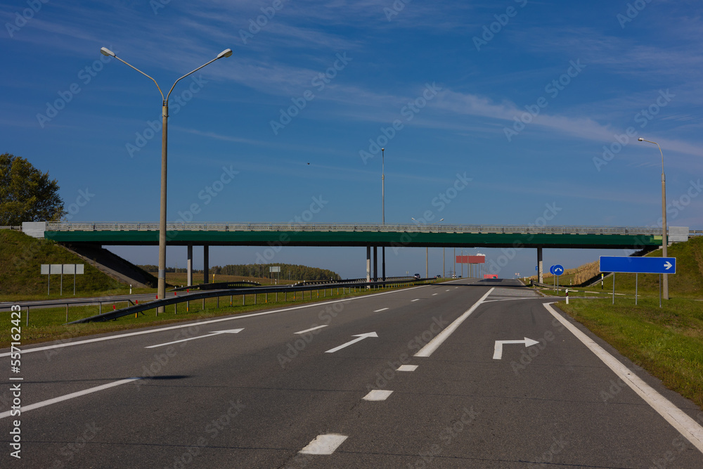 Fototapeta premium Bridge, roadside and asphalt, blue sky in the city streets in public places.