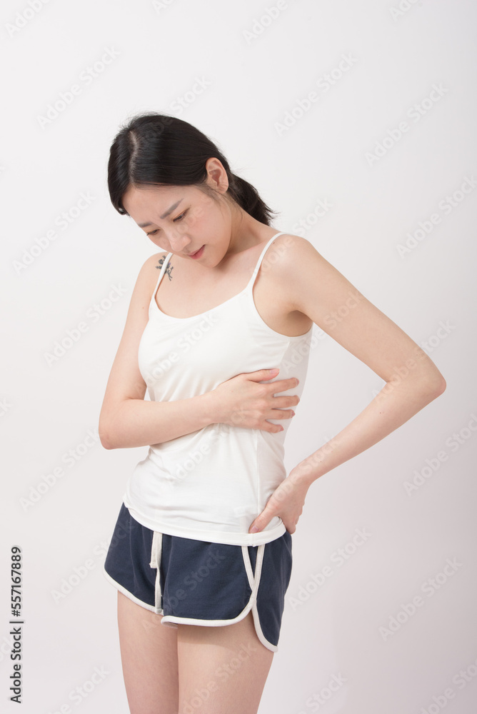 adult woman feels sick, while standing and suffering from unbearable pain. adult woman feels sick, while standing and suffering from unbearable pain.
