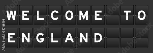 Black color analog flip board with word england welcome to on gray background