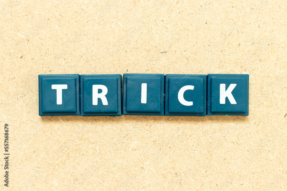 Tile alphabet letter in word trick on wood background Stock Photo ...