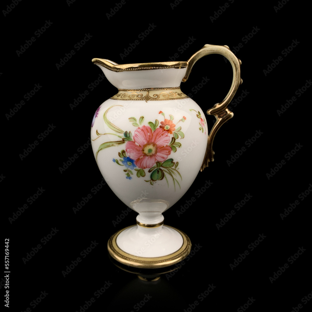 vintage milk jug with floral pattern. antique tea service.
