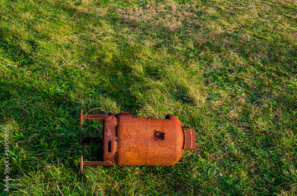 Old rusted wood burner discarded on the grass verge at Tyrella beach County Down Northern Ireland Old rusted wood burner discarded on the grass verge at Tyrella beach County Down Northern Ireland