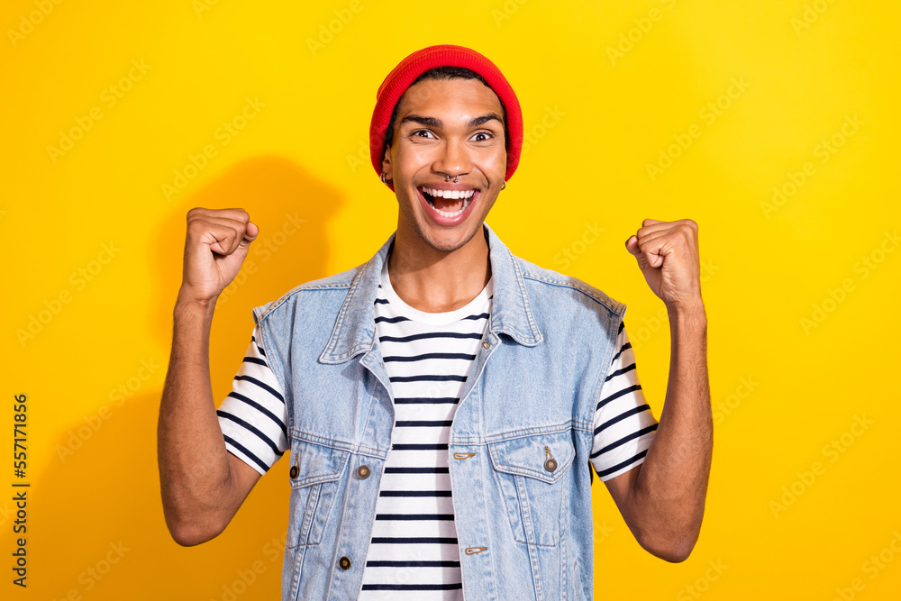 Photo of overjoyed funky man wear trendy clothes scream hooray yeah shopping sale isolated on yellow color background Photo of overjoyed funky man wear trendy clothes scream hooray yeah shopping sale isolated on yellow color background
