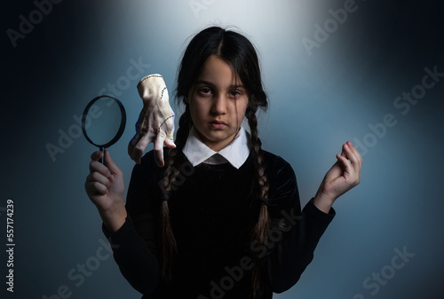 Wednesday student girl on a dark background. photo