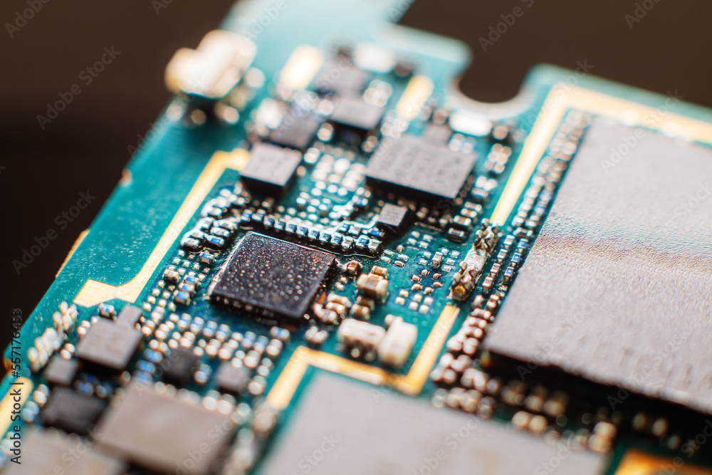 Smartphone PCB and chips super close-up - very small SMD elements Smartphone PCB and chips super close-up - very small SMD elements