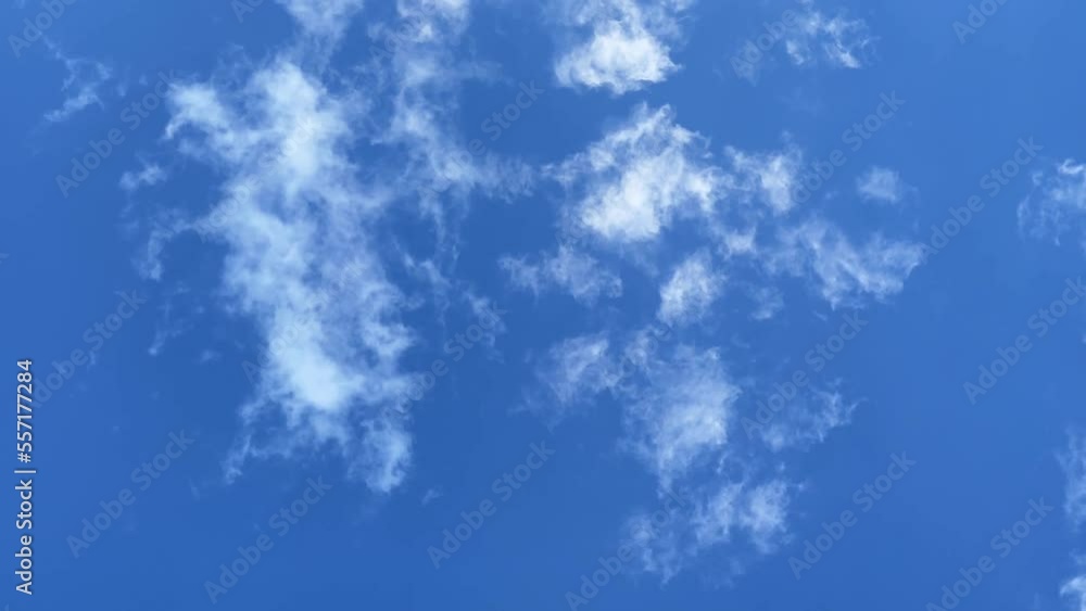 Small cirrus clouds float across the blue sky. Small cirrus clouds float across the blue sky.
