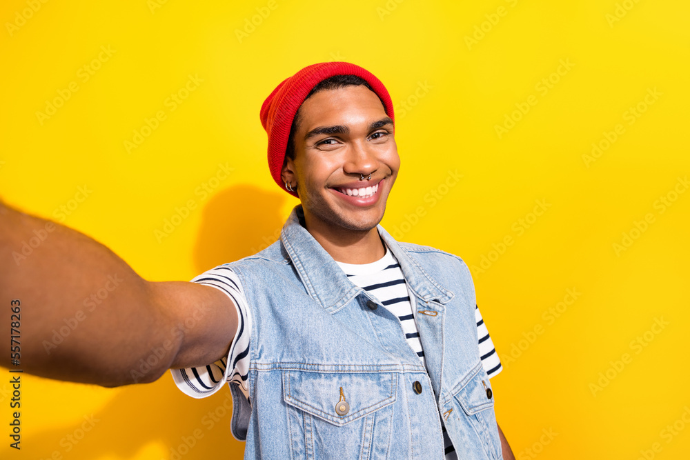 Photo of young glad man wear trendy clothes outfit recording video speaking followers subscribers isolated on yellow color background Photo of young glad man wear trendy clothes outfit recording video speaking followers subscribers isolated on yellow color background
