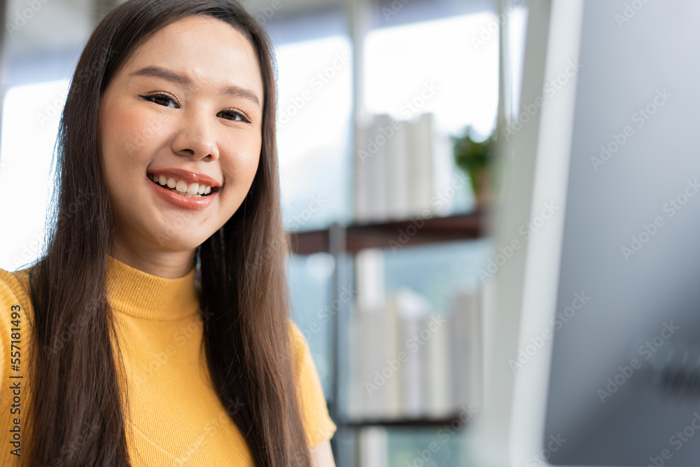 Portrait happy young programmer Asian woman work at start up technology office and using computer for coding application program and fully creative. Concept of smart entrepreneur woman working. Portrait happy young programmer Asian woman work at start up technology office and using computer for coding application program and fully creative. Concept of smart entrepreneur woman working.