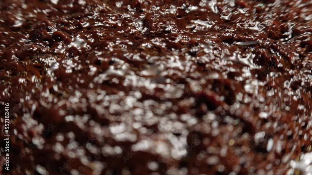 Focus pull on the boiling caramel dessert surface, shallow depth of field, close up. Focus pull on the boiling caramel dessert surface, shallow depth of field, close up.