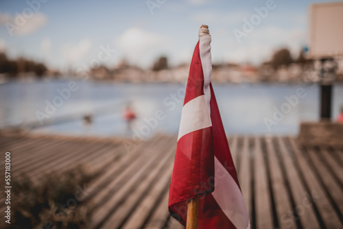 Fotografía Curled up Latvian flag on the back end of a boat