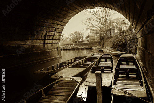 Parked boats under bridge nice stone arch - sephia