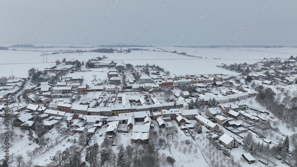 Village winter frost snow drone aerial magic snowy icing ice Bolelouc snowfall. Hana houses scenery cottage and garden magical landscape country Moravia Europe