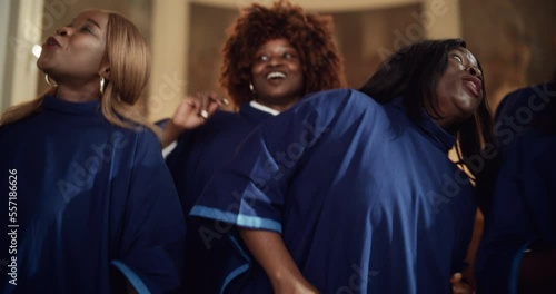Group Of Christian Gospel Singers Praising Lord Jesus Christ. Song Spreads Blessing, Harmony in Joy and Faith. Church is Filled with Spiritual Message and Uplifting Music. Documentary Shot
