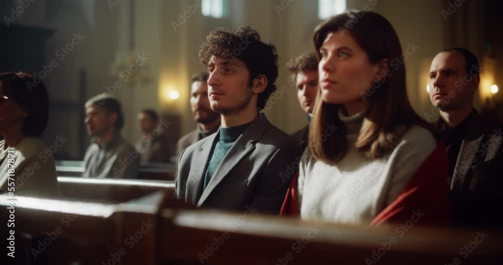 Group Of Faithful Parishioners In Grand Old Church Listening to Sermon. Congregation of Christians Seeking Comfort In Faith And Religious Beliefs. Praying, Seeking Guidance from God. Moving Dolly Shot Group Of Faithful Parishioners In Grand Old Church Listening to Sermon. Congregation of Christians Seeking Comfort In Faith And Religious Beliefs. Praying, Seeking Guidance from God. Moving Dolly Shot