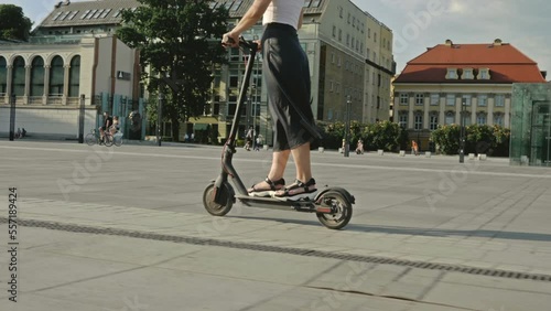 Woman on an electric scooter.