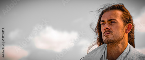 Tableau sur toile portrait of a handsome man who looks like Jesus Christ against dramatic biblical