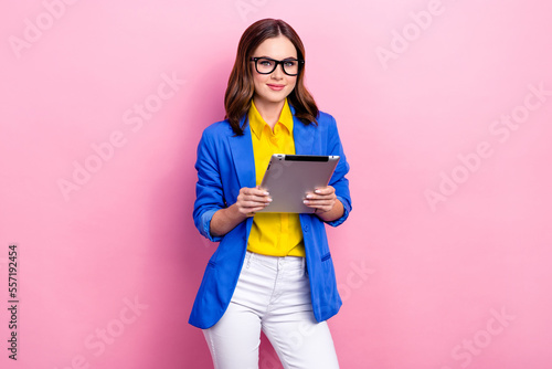 Photo of cute experienced professional business lady secretary employer hold tablet wear glasses formal outfit isolated on pink color background photo