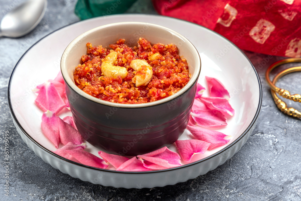 Gajar ka halwa is a traditional Punjabi dessert pudding from India made from carrots and served in a bowl. Garnished with cashew, almond and pistachio nuts Gajar ka halwa is a traditional Punjabi dessert pudding from India made from carrots and served in a bowl. Garnished with cashew, almond and pistachio nuts