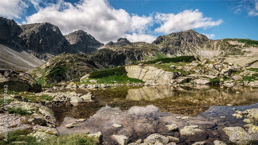 mountain landscape with lake and mountains
High Tatras
 Tatra Mountains