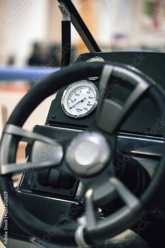 Steering wheel and dashboard of a motor boat. © bizoo_n