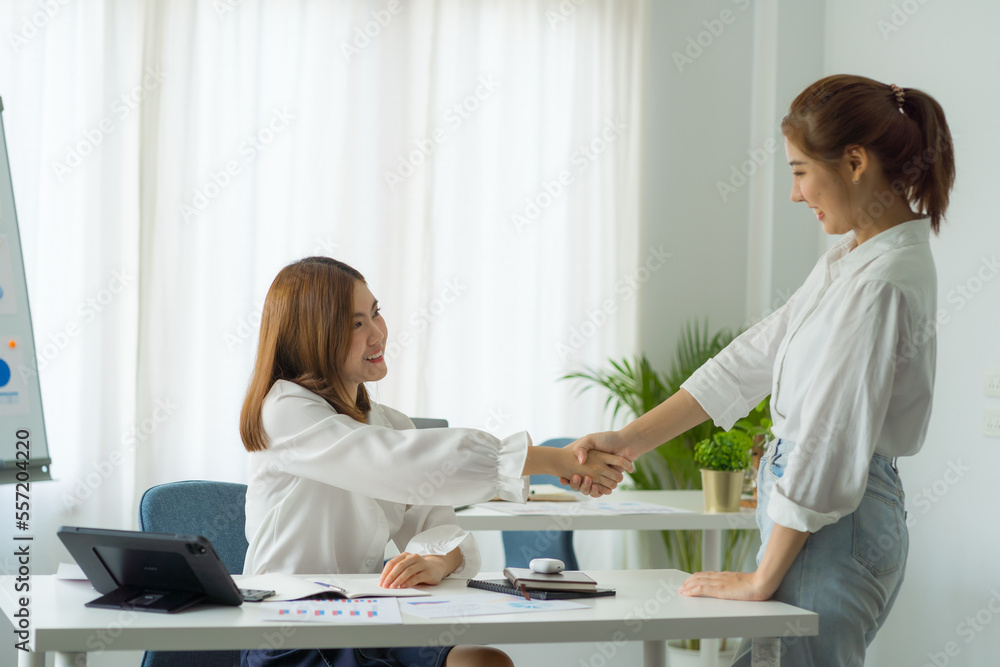 Friends of asia female employee worker discussing and accountant checking data document for investigation of corruption account. Anti Bribery concept, great business conversations Friends of asia female employee worker discussing and accountant checking data document for investigation of corruption account. Anti Bribery concept, great business conversations