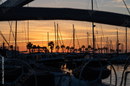 Fototapeta Naklejka Na Ścianę i Meble -  Sunset over the sea with sailboat silhouette