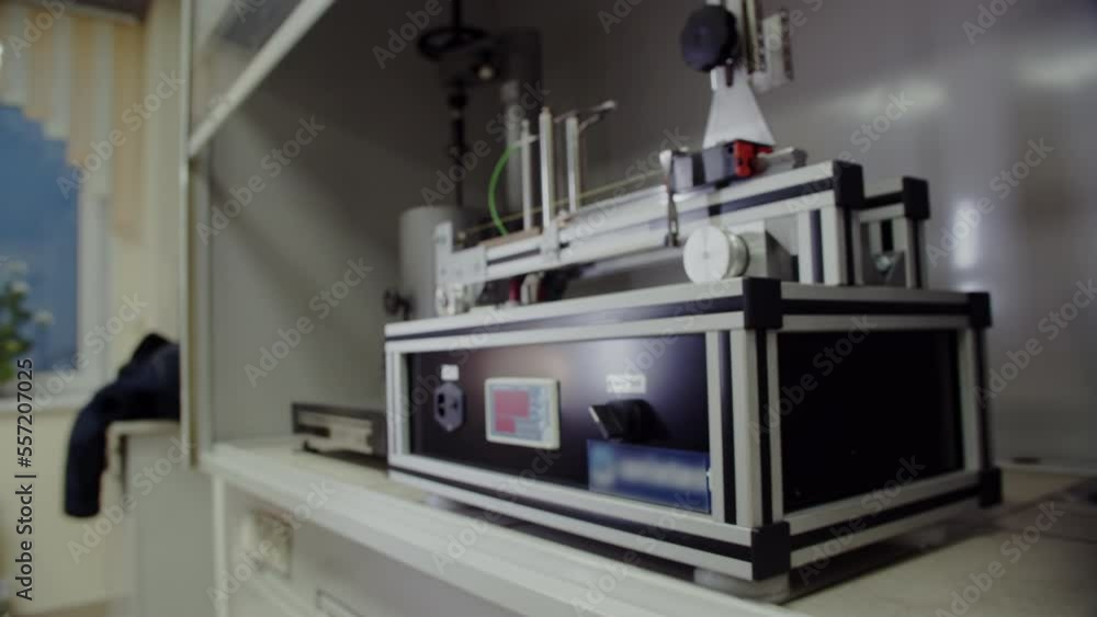 Modern device for quality control at production. Testing machines for determining properties of polymer materials in research laboratory closeup Modern device for quality control at production. Testing machines for determining properties of polymer materials in research laboratory closeup