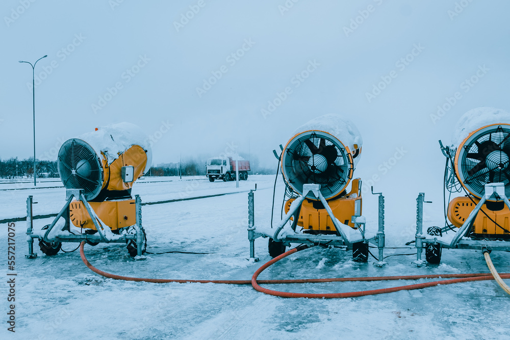 Snow cannons spray artificial snow crystals. Production of artificial snow. Cars make snow. Snow guns.