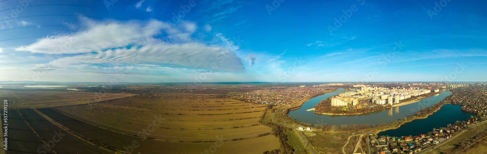 rice paddies after harvest near the Kuban river and the cities of Krasnoadr - aerial view panoramic view on a winter day