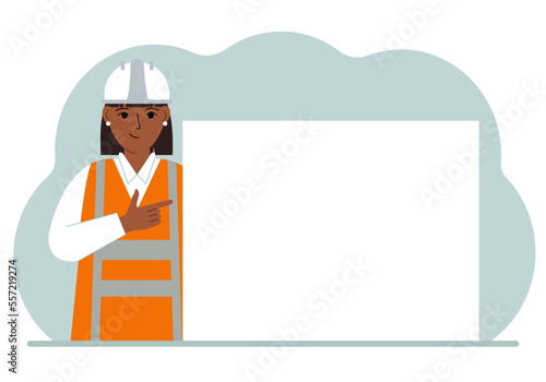 A female worker or builder points his finger at a blank large banner, a blank poster or a large white sheet of paper with space for text.
