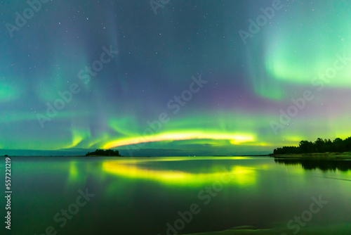 Northern lights reflected in water. Storsand, Jakobstad/Pietarsaari Finland.