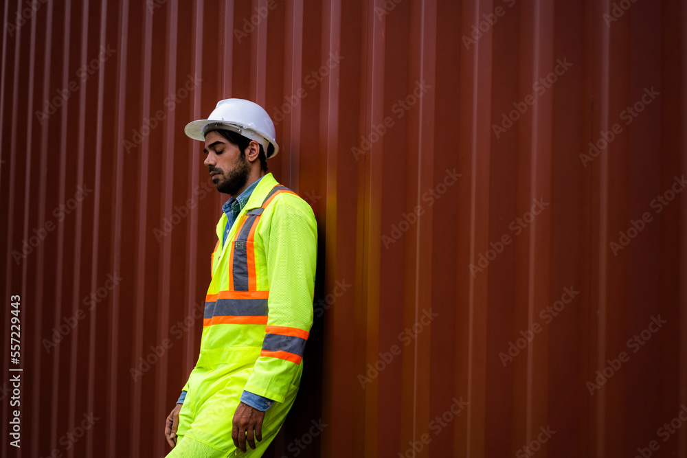 Workers resting at the container yard Work on hot days. Fatigue, overwork, stress, stressful work Workers resting at the container yard Work on hot days. Fatigue, overwork, stress, stressful work